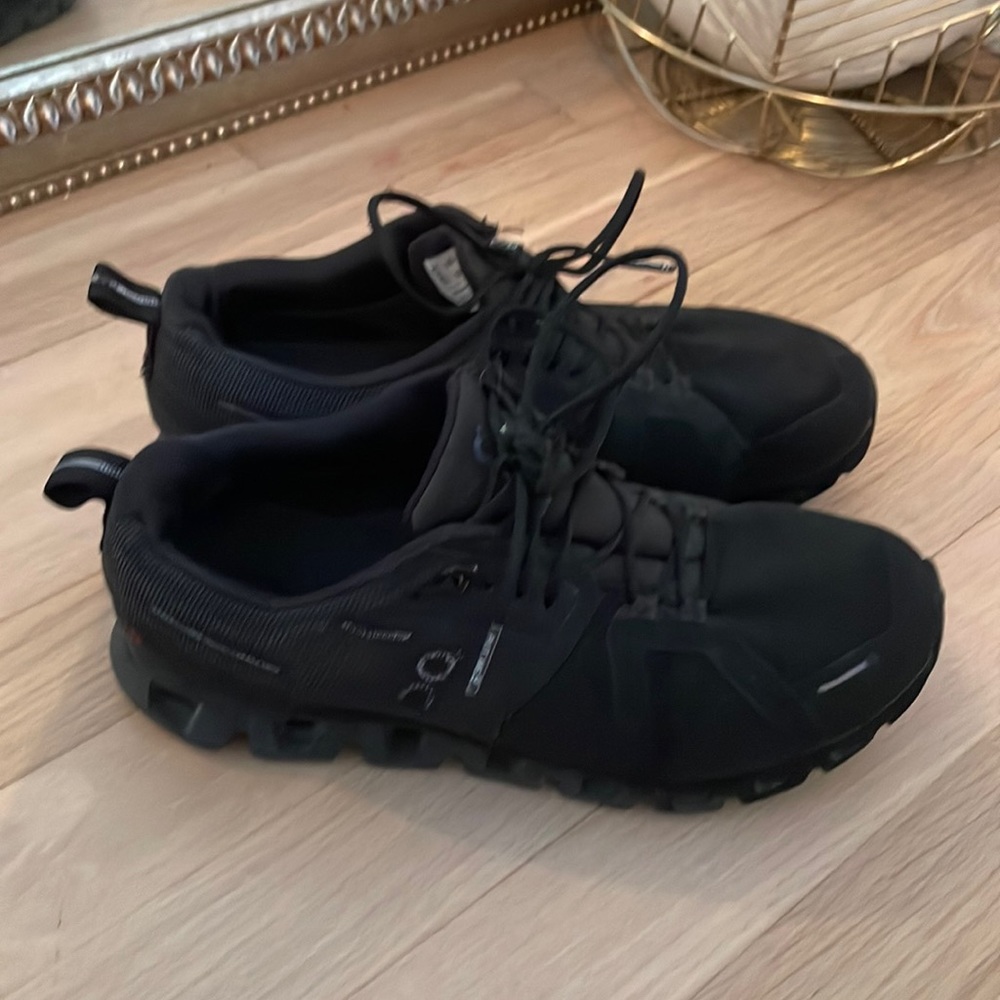 On cloud shoes all black